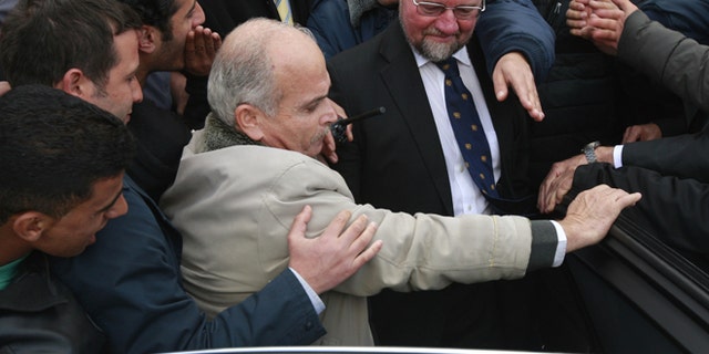 March 5, 2013: Palestinians students block the British consul general Sir Vincent Fean, center wearing glasses, from giving a speech at the Birzeit University, near Ramallah.