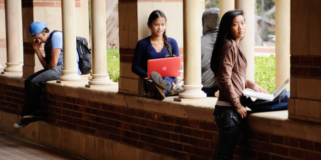 LOS ANGELES, CA - APRIL 23: Students take a break at Royce Hall on the campus of UCLA on April 23, 2012 in Los Angeles, California. According to reports, half of recent college graduates with bachelor's degrees are finding themselves underemployed or jobless. (Photo by Kevork Djansezian/Getty Images)