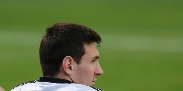 Argentina's Lionel Messi sits during a training session in Vespesiano, near Belo Horizonte, Brazil, Thursday, July 10, 2014. On Sunday, Argentina faces Germany for the World Cup final soccer match in Rio de Janeiro. (AP Photo/Victor R. Caivano)