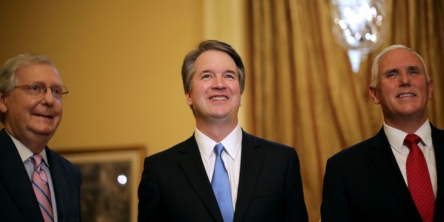 Senate Majority Leader Mitch McConnell (R-KY), Judge Brett Kavanaugh and Vice President Mike Pence pose for photographs before a meeting in McConnell's office in the U.S. Capitol July 10, 2018 in Washington, DC. (Photo by Chip Somodevilla/Getty Images)