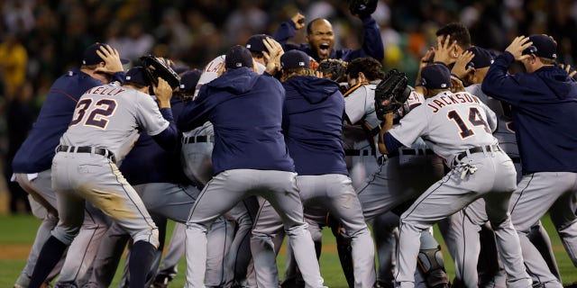 The Detroit Tigers celebrate after beating the Oakland Athletics 3-0 in to win Game 5 of an American League baseball division series in Oakland, Calif., Thursday, Oct. 10, 2013. (AP Photo/Marcio Jose Sanchez)
