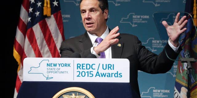 FILE - In this Dec. 10, 2015, file photo, New York Gov. Andrew Cuomo speaks during an economic development awards ceremony in Albany, N.Y. After the NYCLU filed its lawsuit in 2011, Cuomo saw it as an opportunity to improve New York's prison standards and instructed his staff to negotiate. New York prison officials agreed Wednesday, Dec. 16, 2015, to overhaul their use of solitary confinement, offering a broad slate of reforms aimed at reducing the number of inmates sent to "the box," limiting the amount of time they can spend there and providing counseling to help long-term solitary inmates adjust to life on the outside. (AP Photo/Mike Groll, File)