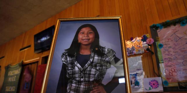 FILE - In this May 6, 2016 file photo a portrait of Ashlynne Mike is on display inside the lobby of the Farmington Civic Center in Farmington, N.M. Mike's father has sued the tribe for failing to have an emergency notification system that he claims would have saved his daughter's life. (Jon Austria /The Daily Times via AP, File)