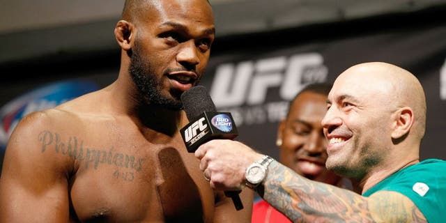 BALTIMORE, MD - APRIL 25: (L-R) Jon "Bones" Jones is interviewed by Joe Rogan during the UFC 172 weigh-in at the Baltimore Arena on April 25, 2014 in Baltimore, Maryland. (Photo by Josh Hedges/Zuffa LLC/Zuffa LLC via Getty Images)