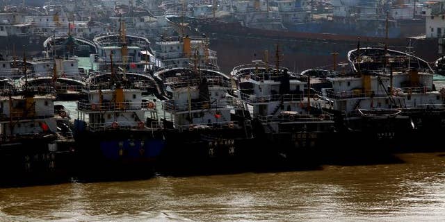 More than 70 people were missing after three fishing boats sank in a powerful typhoon in the South China Sea, Chinese state media says