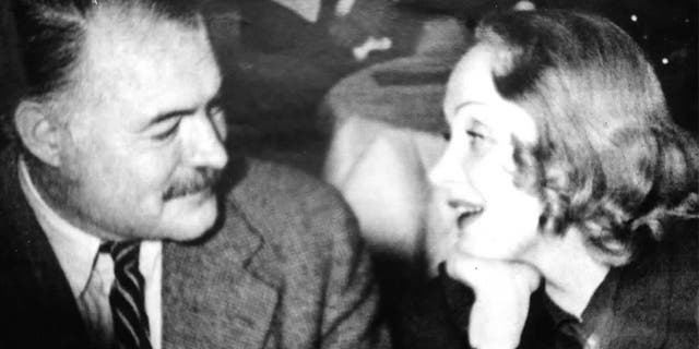 Marlene Dietrich with Ernest Hemingway.