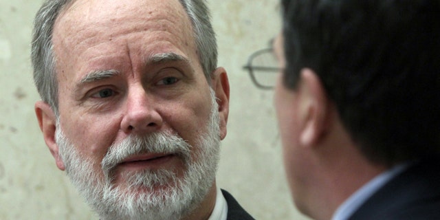 March 7, 2012: David Coppedge, left, is shown outside Los Angeles Superior Court with his attorney, William Becker.