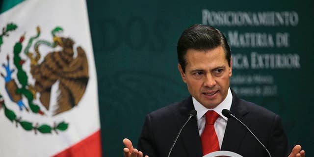 Mexico's President Enrique Pena Nieto speaks during a press conference at Los Pinos presidential residence in Mexico City, Monday, Jan. 23, 2017. Pena Nieto said Monday that Mexico's attitude towards the Donald Trump administration should not be aggressive or biased, but one of dialogue. (AP Photo/Marco Ugarte)
