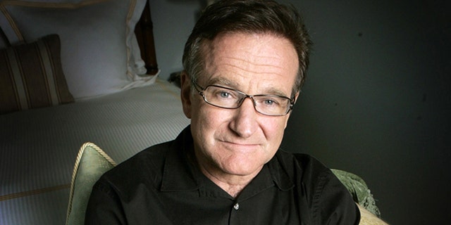 FILE - This June 15, 2007 file photo shows actor and comedian Robin Williams posing for a photo in Santa Monica, Calif. Williams, whose free-form comedy and adept impressions dazzled audiences for decades, died Monday, Aug. 11, 2014, in an apparent suicide. Williams was 63. (AP Photo/Reed Saxon, File)