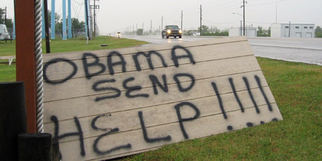 May 2: A sign on the side of a road in Boothville, La. calls for help to combat the massive Gulf oil spill.