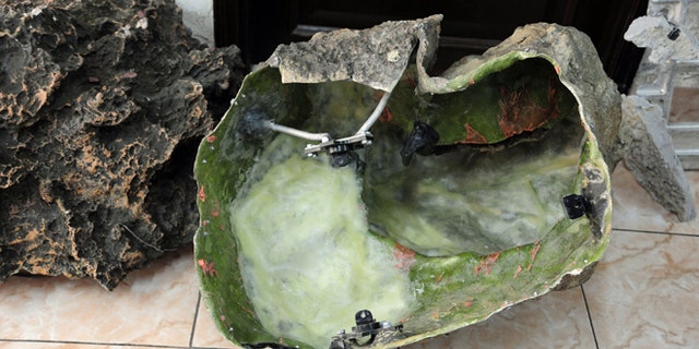 In this photo released by the Syrian official news agency SANA, shows devices that appear to be like rocks that were found in countrys coastal region, northwest of Damascus, Syria, Thursday, March. 7, 2013. Syria's state-run media said they were placed by Israel to spy on Syria.