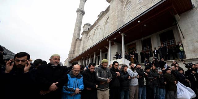 Members of pro-Islamic groups shout slogans after they held funeral prayers on Friday to honor Cherif and Said Kouachi, the gun-toting brothers who killed 12 people last week in Paris, in Istanbul, Turkey, Friday, Jan. 16, 2015. Some 160 people — all of them men — shouted "God is great!" and they held a banner showing former al-Qaida leader Osama Bin Laden's picture on one side, and the Kouachi brothers superimposed over the Parisian skyline on the other. Smaller posters with "We are all Cherif" and "We are all Said" were bounced up. (AP Photo)
