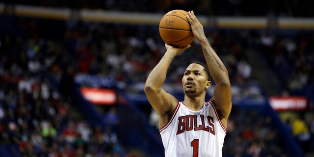 ADVANCE FOR WEEKEND EDITIONS, OCT. 26-27- FILE - In this Oct. 7, 2013, file photo, Chicago Bulls' Derrick Rose shoots a free throw during an NBA preseason basketball game against the Memphis Grizzlies in St. Louis. The Bulls have their point guard back, and they believe they're ready to challenge LeBron James and the Miami Heat for supremacy in the Eastern Conference, starting with their season-opening matchup on Oct. 29. (AP Photo/Jeff Roberson, File)