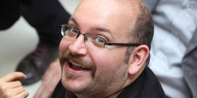 FILE - In this photo April 11, 2013 file photo, Jason Rezaian, an Iranian-American correspondent for The Washington Post, smiles as he attends a presidential campaign of President Hassan Rouhani in Tehran, Iran. Rezaian will face the second day of his closed-door espionage trial on Monday, June 8, 2015, Iran's semi-official ISNA news agency reported Wednesday. (AP Photo/Vahid Salemi, File)