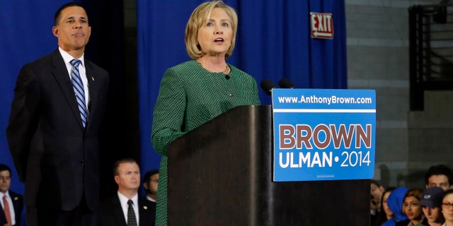 Former Secretary of State Hillary Rodham Clinton, right, campaigns for Maryland Democratic gubernatorial candidate, Lt. Gov. Anthony Brown, left, during a rally at the University of Maryland, Thursday, Oct. 30, 2014, in College Park, Md. (AP Photo/Patrick Semansky)