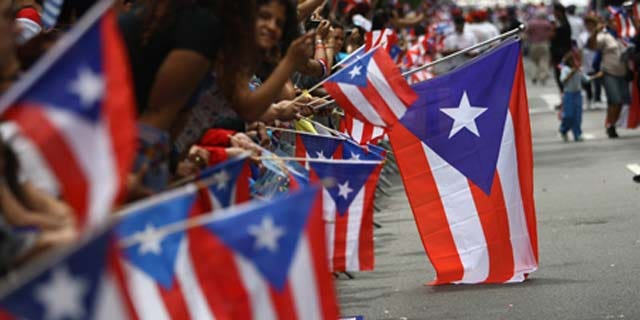 June 14, 2009: Revelers celebrate during the 2009 Puerto Rican Day Parade on the streets of Manhattan in New York City.