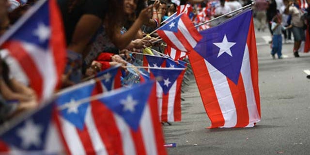 June 14, 2009: Revelers celebrate during the 2009 Puerto Rican Day Parade on the streets of Manhattan in New York City.