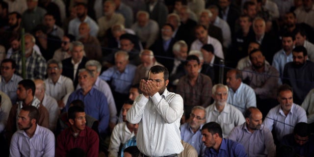 An Iranian worshipper prays at the start of Friday prayers at Tehran University in Tehran, Iran, Friday, May 17, 2013. (AP Photo/Vahid Salemi)