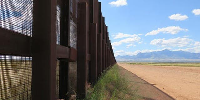 This Wednesday, Sept. 16, 2015 photo shows a part of the border fence near Naco, Ariz., during a tour of the border hosted by the Cochise County Sheriff's Office. Ranchers in this area say the border needs a wall to keep out drug smugglers and illegal border crossers. (AP Photo/Astrid Galvan)