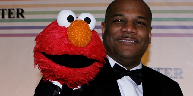 Kevin Clash (right) and Elmo.