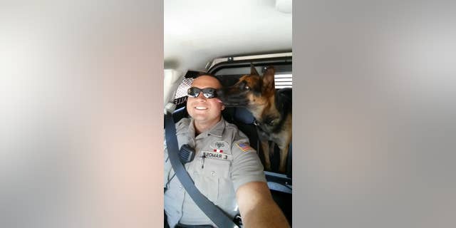 Abbie pictured with her handler, Deputy Eliseo Ramos.