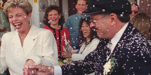 Toni Tennille (L) and Daryl Dragon singing duo "The Captain and Tennille", after renewing wedding vows in 1995.
