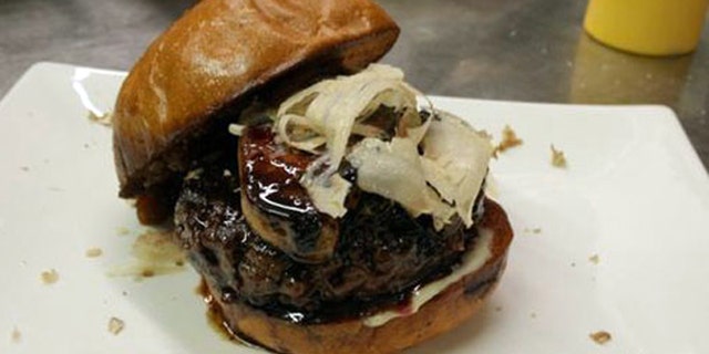 The MNO Burger is topped with truffles, foie gras and port.