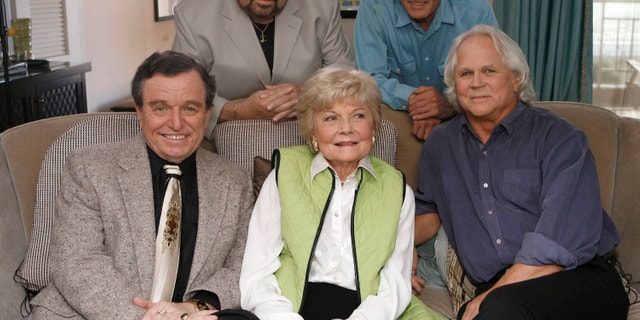 In this Sept. 27, 2007 file photo, seated, from left, Jerry Mathers, Barbara Billingsley and Tony Dow, and, standing from left, Frank Bank and Ken Osmond, pose for a photo as they are reunited to celebrate the 50th anniversary of the television show, “Leave it to Beaver,” in Santa Monica, Calif.