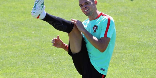 Portugal's Pepe stretches during a training session in Marcoussis, near Paris, France, Saturday, July 9, 2016. Portugal will face France in a Euro 2016 final soccer match in Saint Denis on Sunday, July 10, 2016. (AP Photo/Thibault Camus)