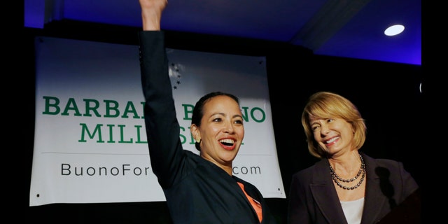 Labor leader Milly Silva reacts Monday, July 29, 2013, in East Rutherford, N.J., as she is introduced as Democratic gubernatorial candidate Barbara Buono's, right, nominee for lieutenant governor. The 43-year-old Montclair resident and executive vice president of a private union of health care workers, wasted no time attacking Republican Gov. Chris Christie, whose policies she says have hurt the middle- and working-class. The all-female ticket is a first for New Jersey and only the third nationwide. (AP Photo/Mel Evans)