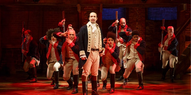Lin-Manuel Miranda, center, performs in the musical "Hamilton" at The Public Theater in New York.