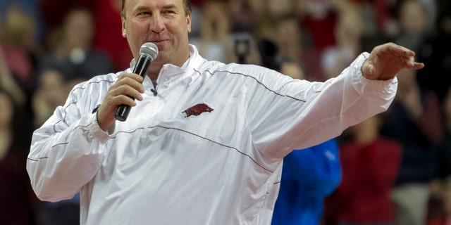 Arkansas head football coach Bret Bielema speaks during a time out in the first half an NCAA college basketball game against Tennessee in Fayetteville, Ark., Saturday, Feb. 2, 2013. Arkansas defeated Tennessee 73-60. (AP Photo/Gareth Patterson)