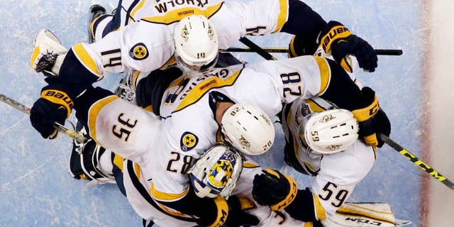 Nashville Predators celebrates a 2-1 win over the Anaheim Ducks during Game 7 in an NHL hockey Stanley Cup playoffs first-round series in Anaheim, Calif., Wednesday, April 27, 2016. (AP Photo/Chris Carlson)