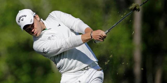 FILE - In this Sunday, April 10, 2016 file photo, Danny Willett, of England, tees off on the 12th hole during the final round of the Masters golf tournament in Augusta, Ga. Masters champion Danny Willett has been away from golf for a month and has been working harder than ever. Not with his golf clubs, but with a pen. (AP Photo/David J. Phillip, File)