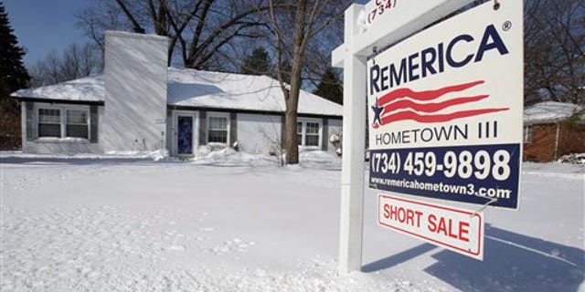 This Wednesday, Feb. 23, 2011 picture shows a foreclosed house for sale in the Detroit suburb of Southfield, Mich. Many in the black middle class moved out of Detroit and settled in the northern suburbs years ago; now, due to foreclosures, it is easy to buy or rent houses on the cheap here. The result has been a new, poorer wave of arrivals from the city, and growing tensions between residents and the newcomers. (AP Photo/Carlos Osorio)