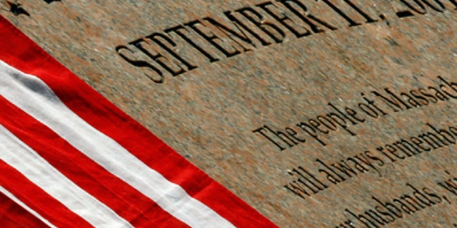 U.S. flag rests on the memorial to Massachusetts victims of the attacks of September 11, 2001 in Boston