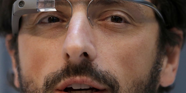 Google co-founder Sergey Brin wears Google Glass glasses at an announcement for the Breakthrough Prize in Life Sciences at Genentech Hall on UCSFs Mission Bay campus in San Francisco, Wednesday, Feb. 20, 2013. (AP Photo/Jeff Chiu)