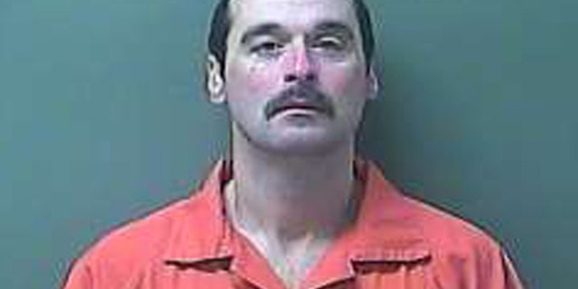 This Monday, Feb. 3, 2014 image provided by the LaPorte County Sheriff's office shows escaped prisoner Michael David Elliot. Elliot, a convicted killer who peeled a hole in two fences with his hands to escape from the Ionia Correctional Facility in western Michigan before abducting a woman and fleeing to Indiana was captured Monday evening after a chase, authorities said. (AP Photo/LaPorte County Sheriff's Office)