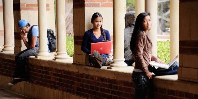 LOS ANGELES, CA - APRIL 23:  Students take a break at Royce Hall on the campus of UCLA on April 23, 2012 in Los Angeles, California. According to reports, half of recent college graduates with bachelor's degrees are finding themselves underemployed or jobless.  (Photo by Kevork Djansezian/Getty Images)