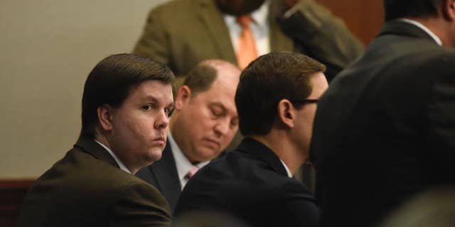 FILE - In this Nov. 14, 2016 file photo, Justin Ross Harris sits with his defense team in the Glynn County Courthouse in Brunswick, Ga. Harris, whose toddler son died after being left for hours in a hot car, was convicted of murder by a jury that concluded a month's worth of trial testimony and evidence showed the father left his child to perish on purpose. (John Carrington/Atlanta Journal-Constitution via AP)