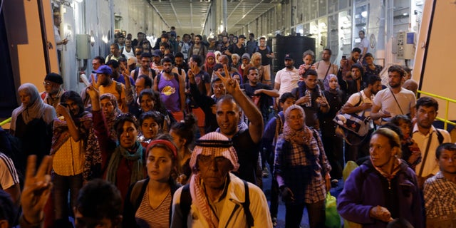 Sept. 1, 2015 - Syrian migrants disembark from boat at Athens port of Piraeus. About 1800 refugees arrived from the northeastern Aegean island of Lesbos as the country has been overwhelmed by record numbers of migrants this year. The vast majority are from Syria & Afghanistan trying to reach more prosperous European countries.