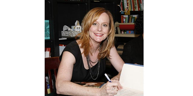 Mary McDonough signing books for fans.