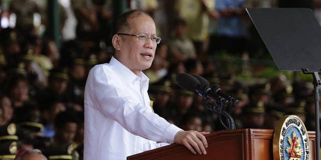 FILE - In this file photo from March 22, 2016, Philippine President Benigno Aquino III delivers a speech south of Manila, Philippines, on Tuesday, March 22, 2016. Aquino has called this week's election a referendum on his "straight path" style of reformist governance, but his candidate Sen. Ferdinand "Bongbong" Marcos Jr. has lost by millions of votes to a shoot-from-the-lip mayor. (AP Photo/Aaron Favila, File)