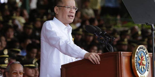 FILE - In this file photo from March 22, 2016, Philippine President Benigno Aquino III delivers a speech south of Manila, Philippines, on Tuesday, March 22, 2016. Aquino has called this week's election a referendum on his "straight path" style of reformist governance, but his candidate Sen. Ferdinand "Bongbong" Marcos Jr. has lost by millions of votes to a shoot-from-the-lip mayor. (AP Photo/Aaron Favila, File)