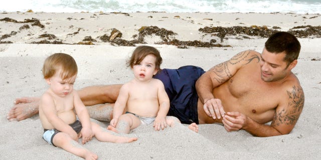 Ricky Martin poses with his sons Valentino and Matteo on August 18, 2009 in Miami, Florida.