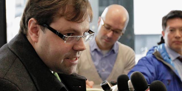 FILE - In this Dec. 21, 2012 file photo, attorney Beau Brindley speaks with reporters at the federal building in Chicago. A federal judge acquitted Brindley Monday Aug. 31, 2015, at a rare trial of a lawyer on multiple counts of perjury and obstruction-of-justice charges for allegedly coaching clients and witnesses to lie. (AP Photo/Teresa Crawford, File)
