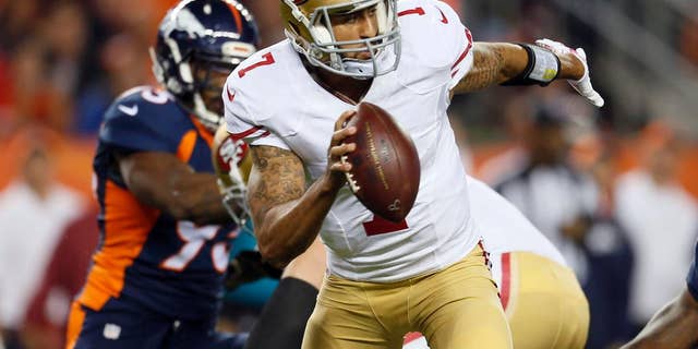 San Francisco 49ers quarterback Colin Kaepernick (7) is hurried against the Denver Broncos during the first half of an NFL football game, Sunday, Oct. 19, 2014, in Denver. (AP Photo/Joe Mahoney)