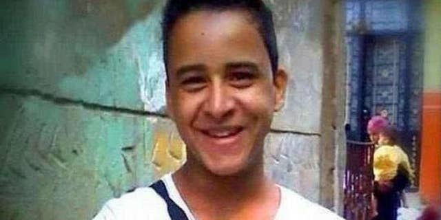 This undated photo provided by the family of Mahmoud Mohammed Ahmed, shows Mahmoud Mohammed Ahmed in Cairo, Egypt prior to his arrest in Jan 2014 while wearing a T-shirt that bore the slogan "A nation without torture." An Egyptian court on Thursday, March 24, 2016 ordered the release of Ahmed, who was accused by police of taking part in unauthorized demonstrations, possession of explosives and paying money to others to take part in street protests, his brother and lawyer told The Associated Press. He was never formally charged during his two years in detention. (Family of Mahmoud Mohammed Ahmed via AP)