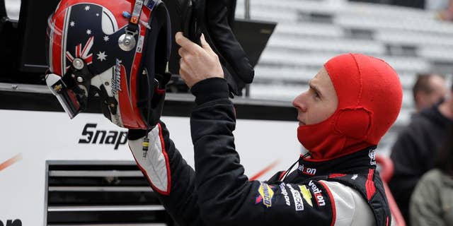Driver Will Power, of Australia, prepares to drive during practice for Indianapolis 500 IndyCar auto race at the Indianapolis Motor Speedway in Indianapolis, Friday, May 16, 2014. (AP Photo/Darron Cummings)