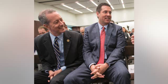 FILE - In this June 9, 2016, file photo, House Intelligence Committee Chairman Rep. Devin Nunes, R-Calif., right, and House Armed Services Committee Chairman Rep. Mac Thornberry, R-Texas, left, talk in Washington. Russia’s violation of a key nuclear arms control treaty has become more egregious, Nunes and Thornberry said in a letter released Oct. 19, that urged the Obama administration to confront and impose penalties against Moscow. (AP Photo/J. Scott Applewhite, File)